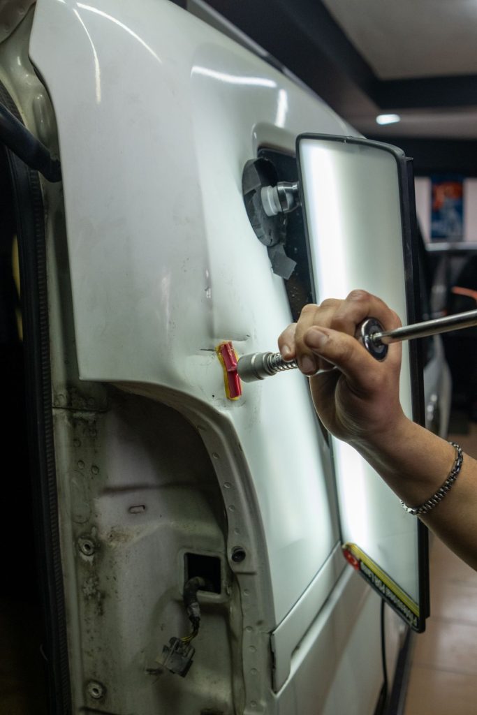 Auto body repair in garage with tools