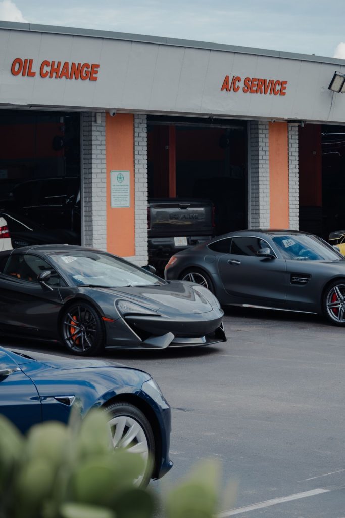 Luxury cars parked at auto service center